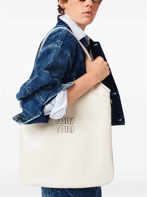 miu miu ivy logo-appliqué tote bag|Miu Miu Ivy logo.